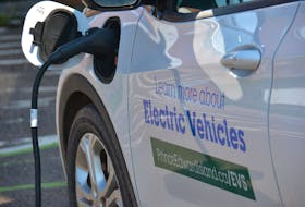 A provincially owned electric vehicle gets a charge in Charlottetown. A report from the province's special committee on climate change recommends the province put in place a hard date in which auto sellers will transition completely to selling electric cars.