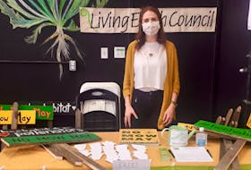 Jessica Frenette and other volunteers handed out signs made of upcycled wood, posters and seeds at the Truro Farmers' Market for people to proudly display and promote the "No Mow May" concept on their lawns.