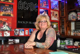 Shavonne Wickens stands at the bar in the 80’s Rewind pubcade that is opening in East Pubnico. KATHY JOHNSON

