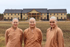 Venerables Joanna, left, Sabrina and Yvonne are nuns at the Great Wisdom Buddhist Institute in Brudenell.