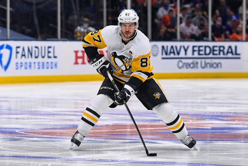 Pittsburgh Penguins centre Sidney Crosby moves the puck against the New York Islanders during the third period of Game 6 of the first round of the 2021 Stanley Cup Playoffs at Nassau Veterans Memorial Coliseum on Wednesday.
