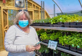 Joanne Krszwda at the United Farmer's Co-Op store on Keltic Drive in Sydney, decided to start gardening this year after her husband bought a small greenhouse for their garden. JESSICA SMITH • CAPE BRETON POST