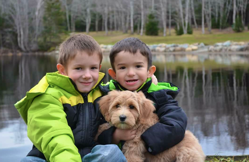 Ben Cosman (right) with his brother Landyn and the family dog Molly. CONTRIBUTED 