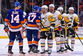 Pittsburgh Penguins centre Sidney Crosby (87) shakes hands with the New York Islanders after losing in Game 6 of the first round of the 2021 Stanley Cup Playoffs at Nassau Veterans Memorial Coliseum on Wednesday. - Dennis Schneidler-USA TODAY Sports
