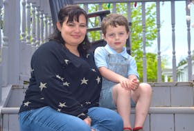 Rebecca Gillis of Sydney with her son Jensen, 4, at home. Gillis said she’s disgusted after making arrangements on Facebook Marketplace to purchase a toy for her son after his surgery and being scammed. Gillis said she has contacted police and is sharing her story to warn people. Sharon Montgomery-Dupe/Cape Breton Post