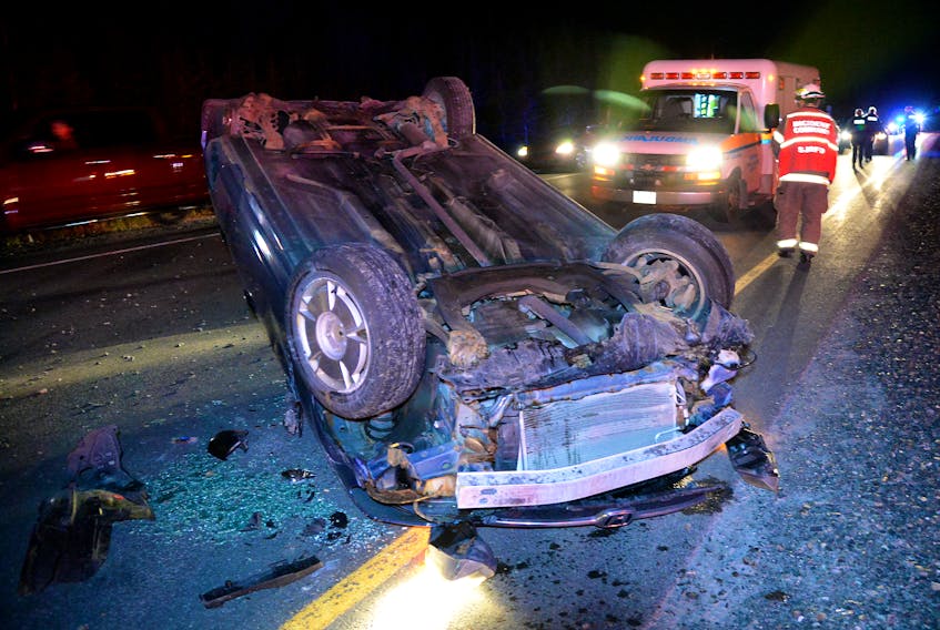 One man was treated for minor injuries when his car overturned as he tried to avoid a moose on Peacekeepers Way Friday night. Keith Gosse/The Telegram