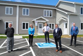 Pictured outside the new NLHS social housing units on Froude Avenue following an announcement on social housing funding Friday, May 28, are, from left, Fraser Piccott, chair of the Board of Directors of the Froude Avenue Community Centre, Julia Mullaley, CEO, NLHC, federal Natural Resources minister Seamus O’Regan, Newfoundland and Labrador Premier Andrew Furey and John Abbott, N.L. minister responsible for the NLHC.