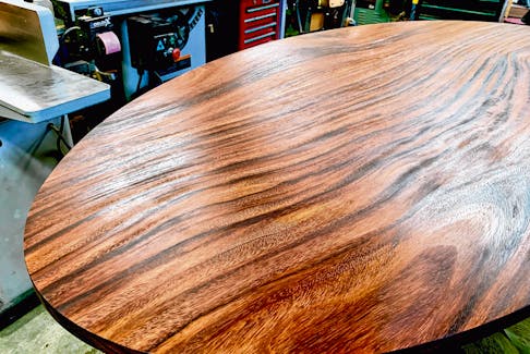 Finishing or refinishing a tabletop is one of the most demanding finishing tasks because the results are seen so closely. Steve finished this acacia wood tabletop using oil and a power buffing process. 