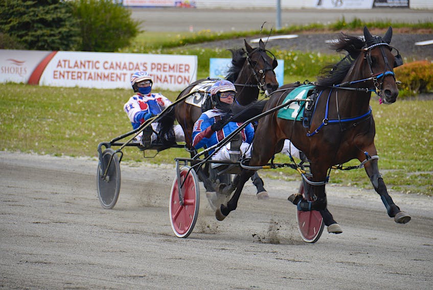 Sports Report with Jason Hughes driving, right, won Race 2 in 2:00.3 at Red Shores at the Charlottetown Driving Park.