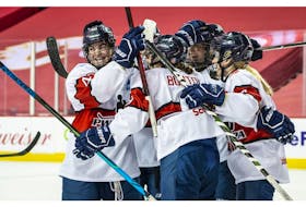 Team Scotiabank players celebrate a goal during their game against Team Bauer during the PWHPA Secret Dream Gap Tour at the Saddledome in Calgary on Friday, May 28, 2021. 
