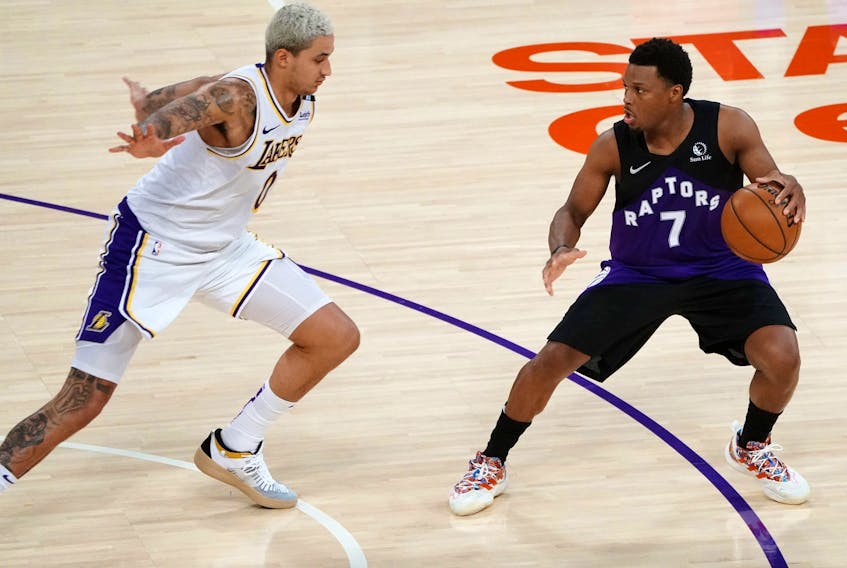 Toronto Raptors guard Kyle Lowry (7) controls the ball against Los Angeles Lakers forward Kyle Kuzma (0) during the second half at Staples Center May 2, 2021. 