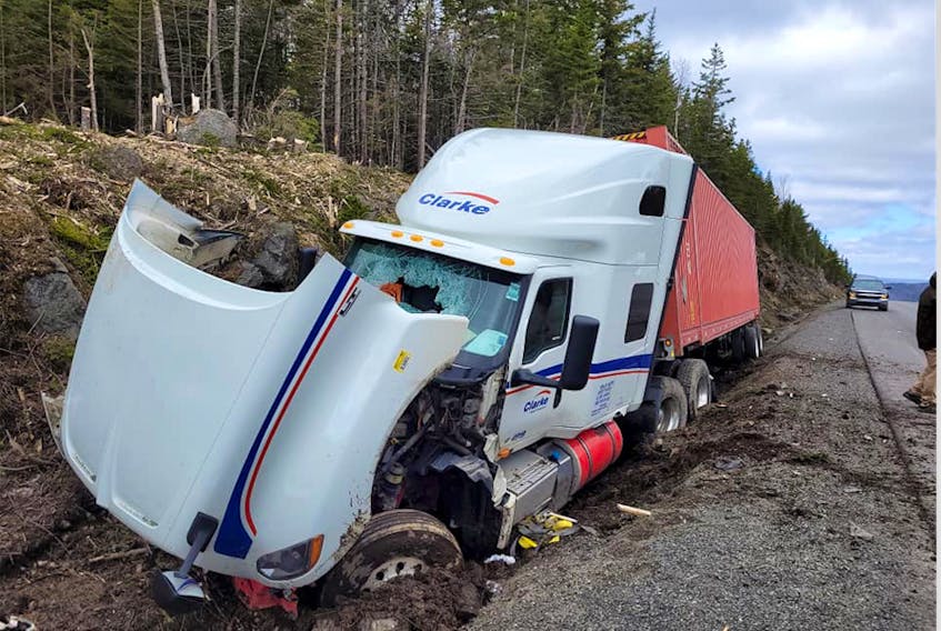 A transport truck in a ditch following a single-vehicle accident by the Englishtown exit on Highway 105 in Victoria County, Monday. -- FACEBOOK