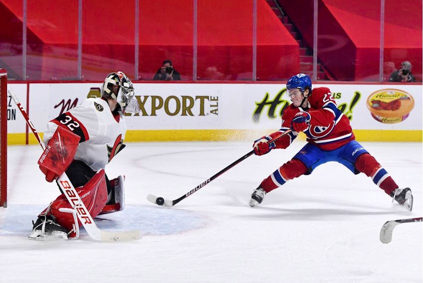  Canadiens forward Cole Caufield (22) scores the winning goal against the Ottawa Senators during the overtime period at the Bell Centre on Saturday, May 1, 2021.