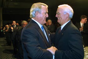 Former prime minister Brian Mulroney, left,  is greeted by former Nova Scotia premier Donald Cameron at a $500-a-plate fundraising dinner for the Progressive Conservative Party in Halifax in 2002.