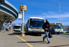 FOR NEWS:
A commuter dashes towards their bus at the Halifax Metro Transit Bridge Terminal in Dartmouth Monday May 3, 2021.

TIM KROCHAK PHOTO