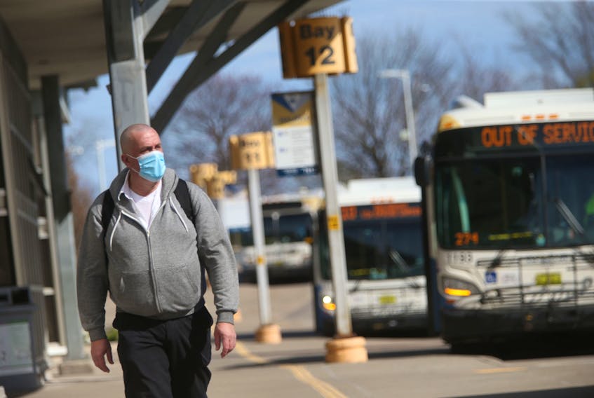 FOR NEWS:
A commuter heads towards their bus at the Halifax Metro Transit Bridge Terminal in Dartmouth Monday May 3, 2021.

TIM KROCHAK PHOTO