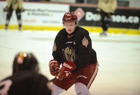Acadie-Bathurst Titan defenceman Cole Larkin skated with his former major under-18 team, the Charlottetown Bulk Carriers Knights, at the Eastlink Centre when he was home for Christmas.
