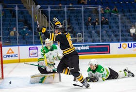 Victoriaville Tigres forward Conor Frenette scores the overtime winner against the Val-d'Or Foreurs Sunday in Game 3 of the Quebec Major Junior Hockey League final in Quebec City.