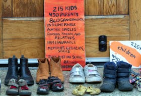 A collection of child-sized shoes are placed outside St. Mary's Basilica on Spring Garden Road. The pairs of footwear symbolize the 215 children found in a mass grave outside a former residential school in Kamloops, BC.