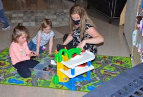 Early childhood educator Jamie Gallant, right, works with Adalynn McNeill, left, and Mariah Duffy Corkum at the Kinkora Early Learning Centre. The facility opened in March 2021.