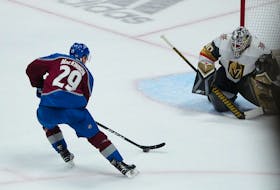 Colorado Avalanche centre Nathan MacKinnon prepares to flip the puck past Vegas Golden Knights goaltender Robin Lehner in the second period of an NHL playoff game at Ball Arena in Denver on Sunday.