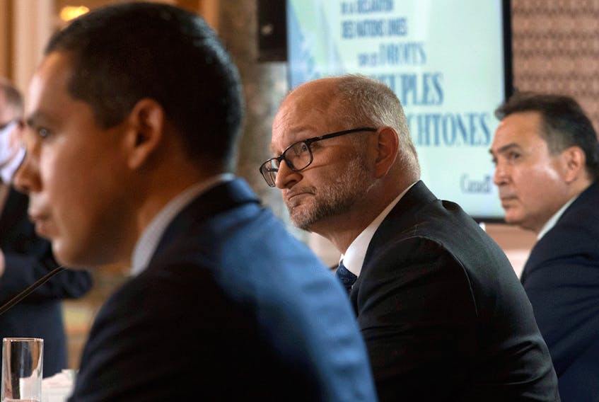 Justice Minister David Lametti, centre, with President of the Inuit Tapiriit Kanatami Natan Obed, left, and Assembly of First Nations Chief Perry Bellegarde at a news conference about the United Nations Declaration on the Rights of Indigenous Peoples (UNDRIP), in Ottawa on Dec. 3, 2020.