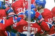 Cole Caufield celebrates with team-mates after scoring game-winning goal in OT against the Toronto Maple Leafs in Montreal on Monday May 3, 2021.