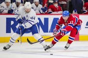 Josh Anderson forechecks against Morgan Rielly of the Toronto Maple Leafs during first-period action in Montreal on Monday May 3, 2021.