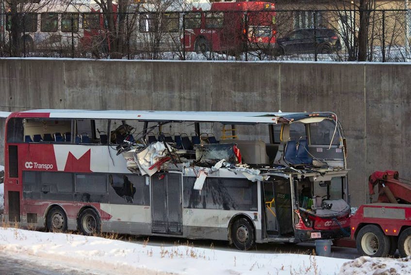  A file photo shows the OC Transpo bus involved in the crash at Westboro Station being towed from the scene.