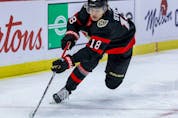  Ottawa Senators left wing Tim Stuetzle controls a loose puck against the Vancouver Canucks at the Canadian Tire Centre.