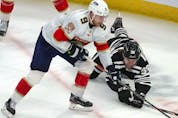  Florida Panthers’ centre Sam Bennett and Chicago Blackhawks left wing Brandon Hagel fight for the puck during the second period at the United Center.
