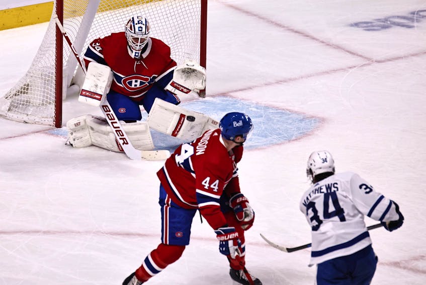 Montreal Canadiens goaltender Jake Allen makes a save against Maple Leafs' Auston Matthews as defenceman Joel Edmundson defends during the second period at Bell Centre on Monday, May 3, 2021. 