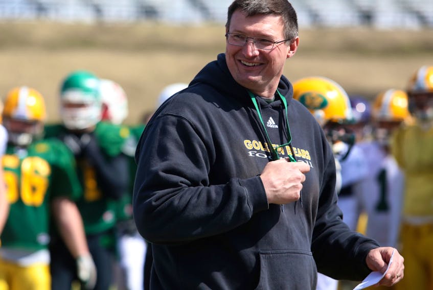  University of Alberta Golden Bears football head coach Chris Morris has a laugh during the team’s annual spring training camp at Foote Field in Edmonton on April 27, 2014. Trevor Robb / Postmedia, file