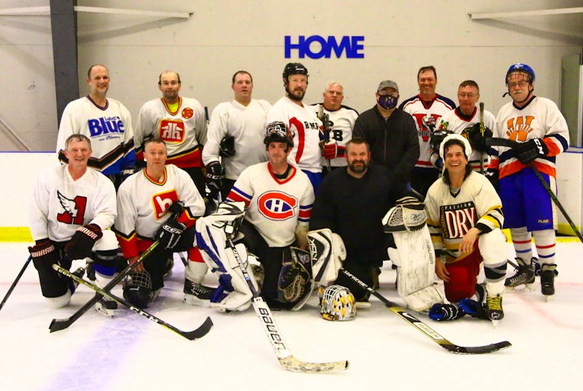 The Newport District Rink All-Stars (formerly the Hants West Flames) alumni team consisted of, from left, back row: Scott Lloy, George Armstrong, Brad Carrigan, Mark Flynn, Dwayne Robarts, bench manager Fred Lunn, Robin Lowthers, Phil Brison, and Garnet Davidson; front row: Doug Swinamer, Glen Earley, Tony Bonang, Jason Archibald, and Mike Church. Missing from the photo are assistant coach Freddy Marshall and trainer Murray Purcell.
JIM IVEY
