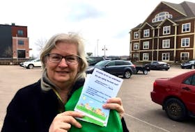 Former Green party candidate Darcie Lanthier holds a copy of the rental registry she launched in February. More than 500 Charlottetown residents have signed on to the registry so far. 
