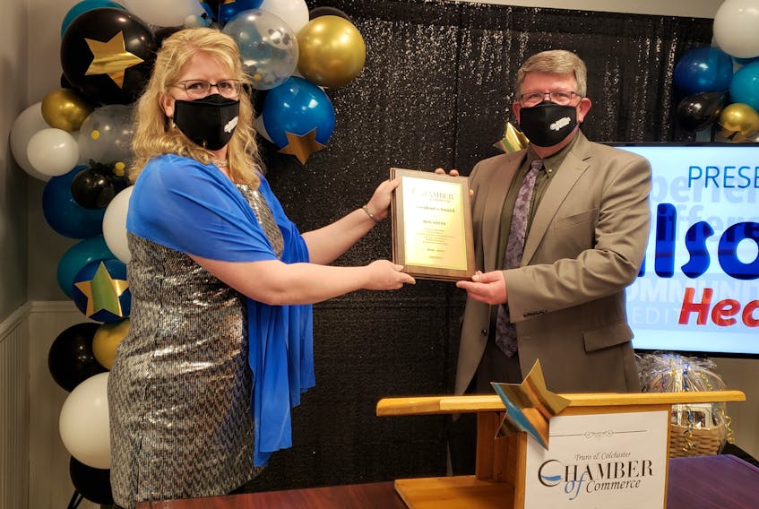 Truro & Colchester Chamber of Commerce Executive Director Sherry Martell presents the Past President award to Ron Smith who served as president from 2019 to 2021. 
