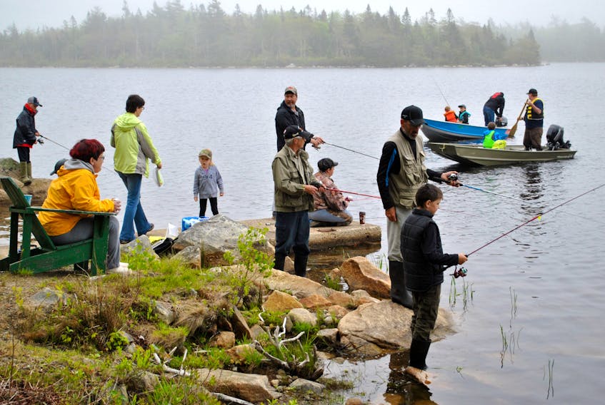 People dot the shoreline at Alvin Lake while others head out in boats for the Shelburne County Fish and Game Association’s annual fishing derby in 2018. While COVID has put a halt to the annual derby, the SCFGA has a vision for an accessible manmade trout fishing pond, perhaps somewhere in the Clyde River area. KATHY JOHNSON