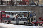 A file photo shows the OC Transpo bus involved in the crash at Westboro Station being towed from the scene.
