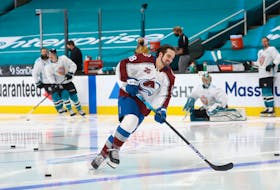 In an NHL tradition, his Colorado Avalanche teammates saw to it that Alex Newhook had a few solo turns during the first part of the warm-up skate prior to the Avalanche's Wednesday-night game against the Sharks in San Jose. Newhook enjoyed the moment, as did onlooking Sharks; players, including defenseman Erik Karlsson (right). — Colorado Avalanche/Twitter