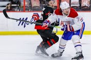 Ottawa Senators defenceman Erik Brannstrom (26) checks Montreal Canadiens right wing Tyler Toffoli (73).