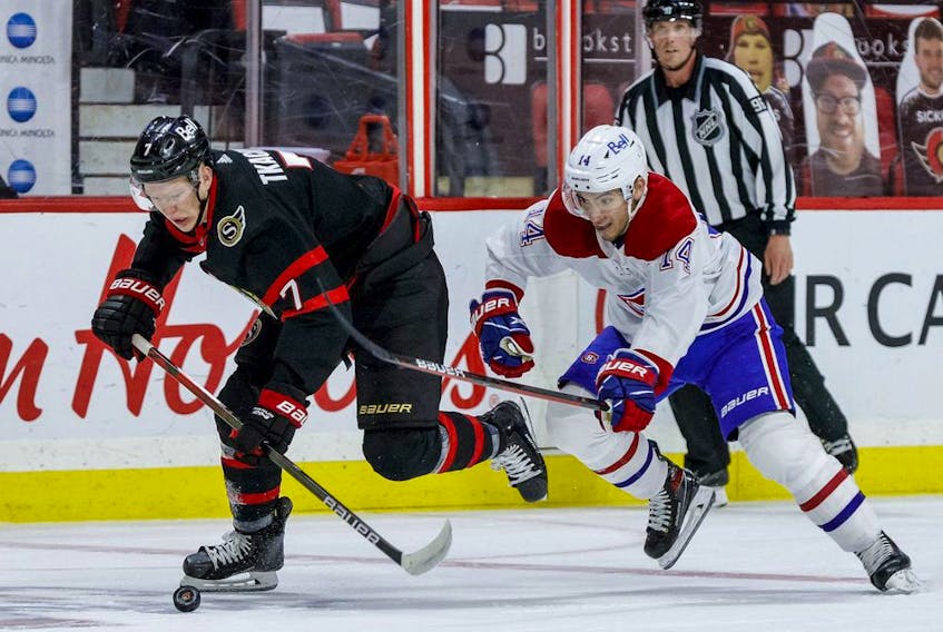 Ottawa Senators left wing Brady Tkachuk (7) gets away from Montreal Canadiens centre Nick Suzuki (14).