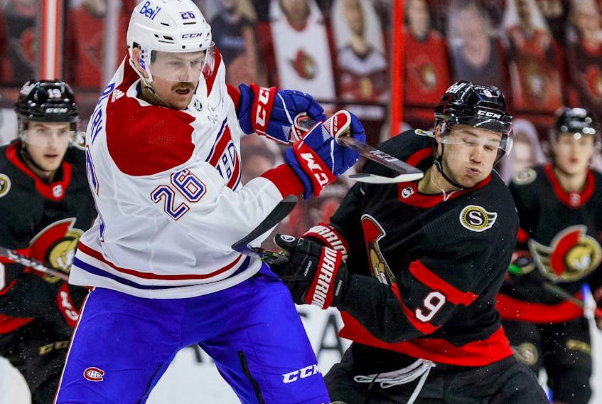 Ottawa Senators centre Josh Norris (9) battles against Montreal Canadiens defenceman Jeff Petry (26) during the third period at the Canadian Tire Centre.
