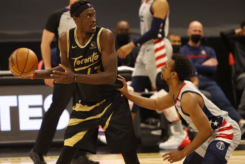 Toronto Raptors forward Pascal Siakam  drives to the basket as Washington Wizards guard Ish Smith defends on Thursday night.