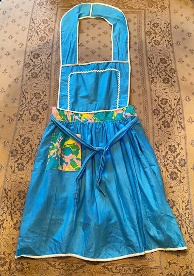 Over the years, I have collected many fancy aprons, but none quite as special as this one.  Mom tells me that I was only five years old when I helped her make it.  I stand a little taller when I wear my pretty apron. Happy Mother's Day, mom!