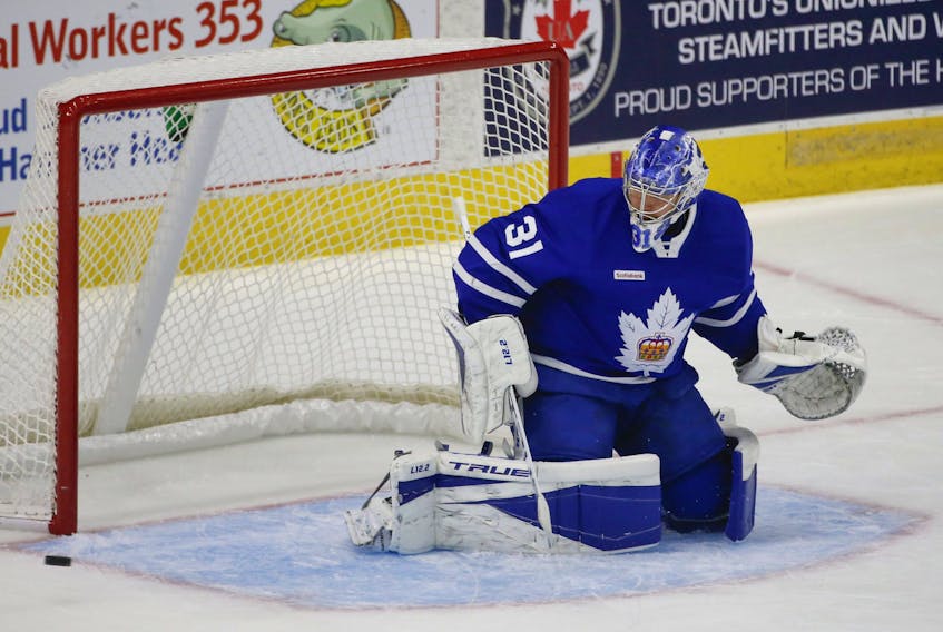 Goalie Frederik Andersen makes a toe save during first-period action during his conditioning stint with the AHL's Marlies in Toronto on Thursday, May 6, 2021. 