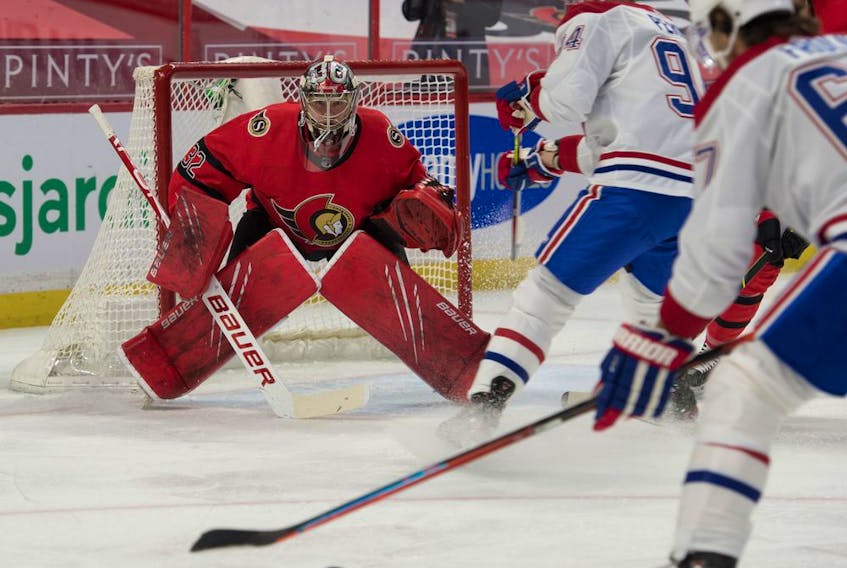 File photo/ Montreal Canadiens right wing Michael Frolik (67) shoots on Ottawa Senators goalie Filip Gustavsson (32) in the first period at the Canadian Tire Centre. 