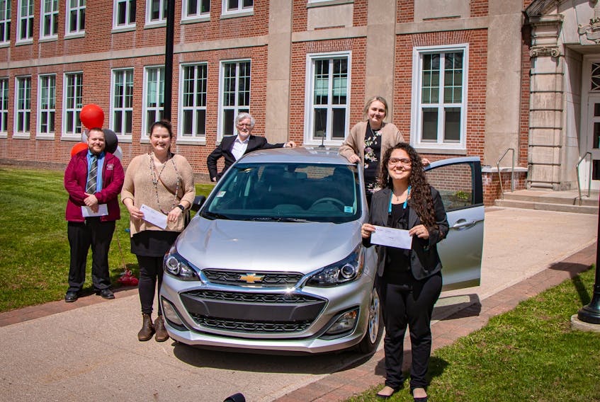 Holland College nursing student Jody Rethy earned a new 2021 Chevrolet Spark for her high grades this year. Four other students received $1,000. Shown, starting from left: Shawn Fraser, Laura Mills, Holland College president Alexander MacDonald, Jodi Rethy and Barbara Kalil. Missing from the photo is finalist Jill Kendall, and donor Lou MacEachern, who joined the event virtually.