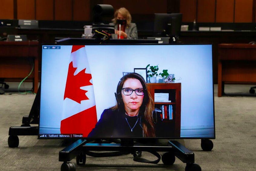 Katie Telford, Chief of Staff to Canada's Prime Minister Justin Trudeau, appears on a screen as she attends a House of Commons defence committee meeting on sexual misconduct in the armed forces, in Ottawa, Ontario, Canada May 7, 2021.