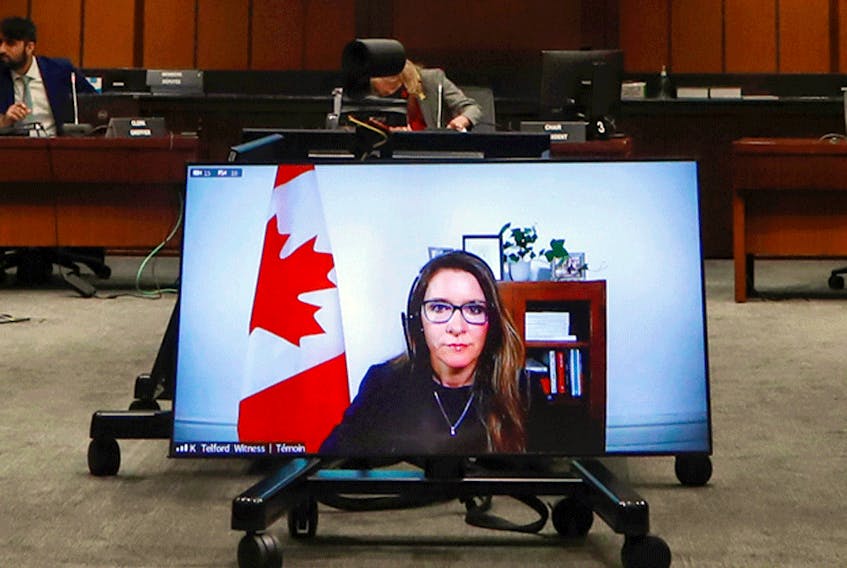  Katie Telford, Chief of Staff to Prime Minister Justin Trudeau, appears on a screen as she testifies at a House of Commons defence committee meeting on sexual misconduct in the Canadian Forces, in Ottawa, May 7, 2021.