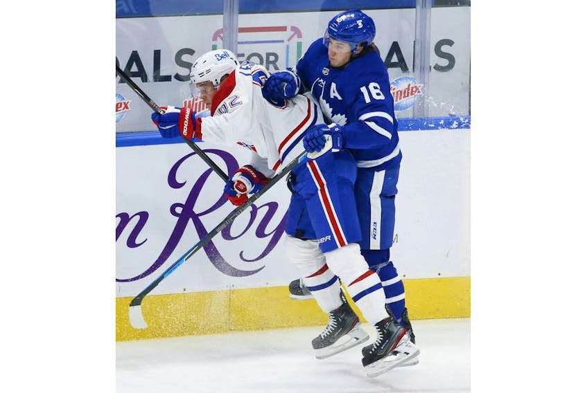 Toronto Maple Leafs Mitch Marner RW (16) hits Montreal Canadiens Artturi Lehkonen RW (62) during second period action in Toronto on Thursday May 6, 2021. Jack Boland/Toronto Sun/Postmedia Network